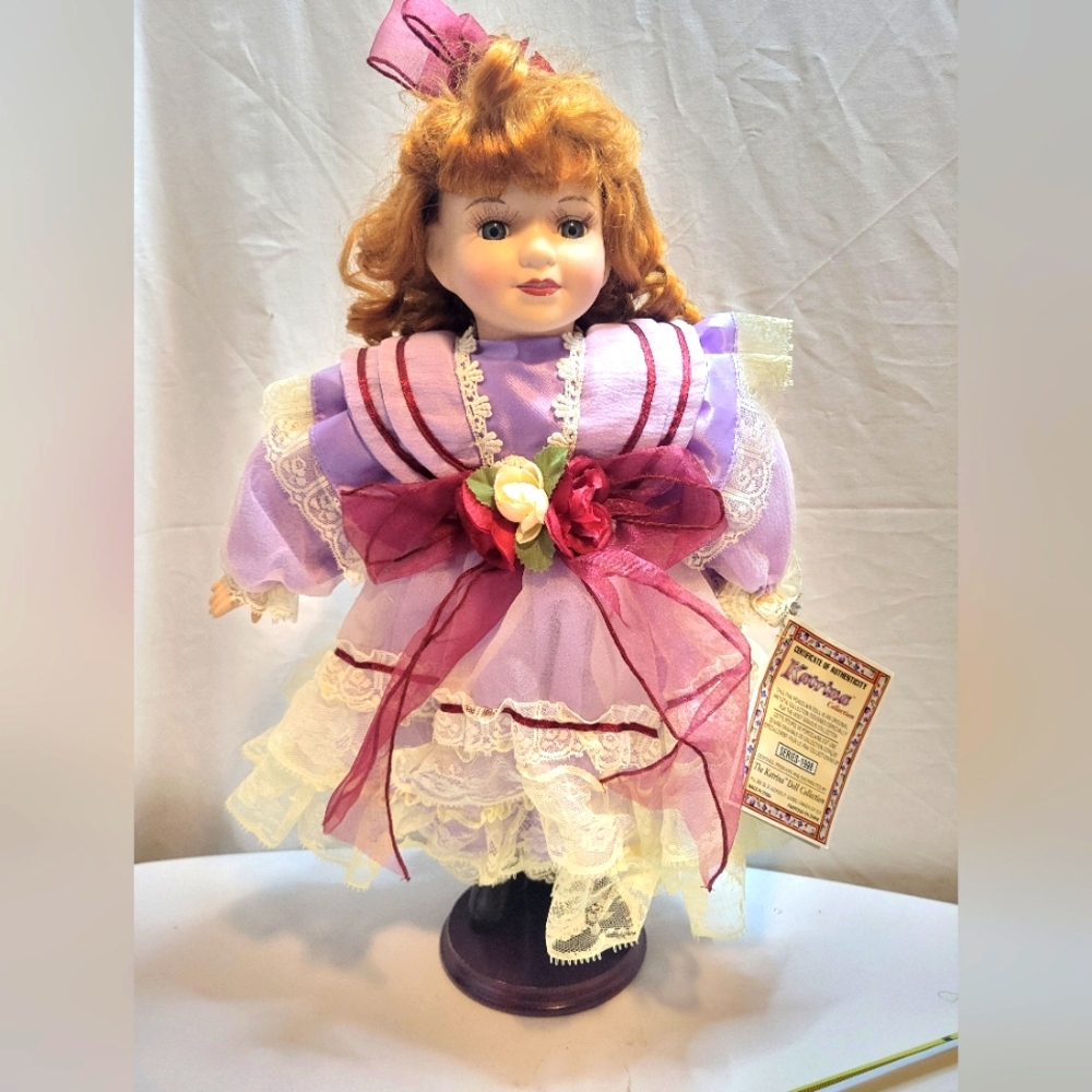 Porcelain Doll with stand and certificate of authentication